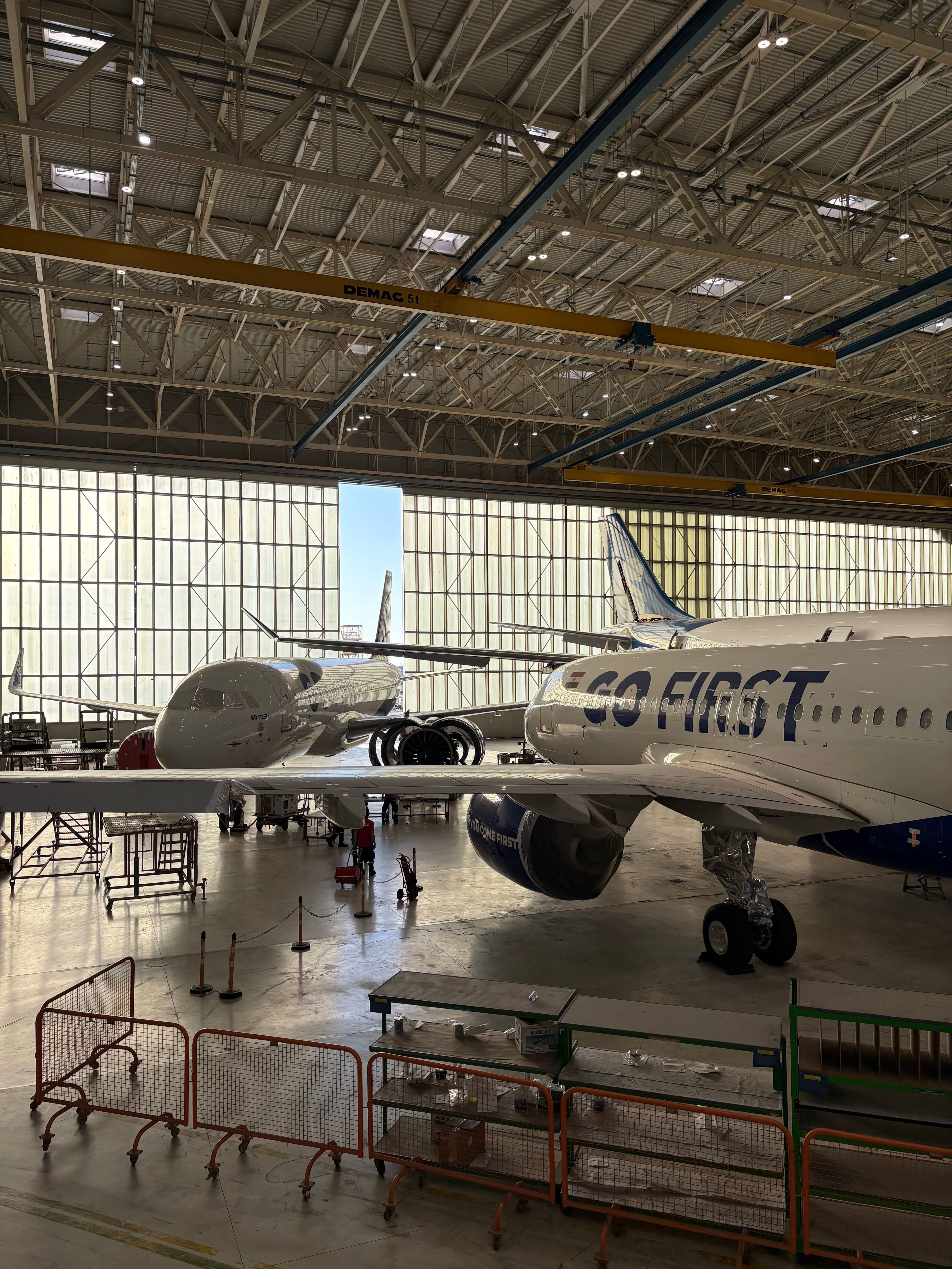 Aircraft undergoing maintenance in a hangar